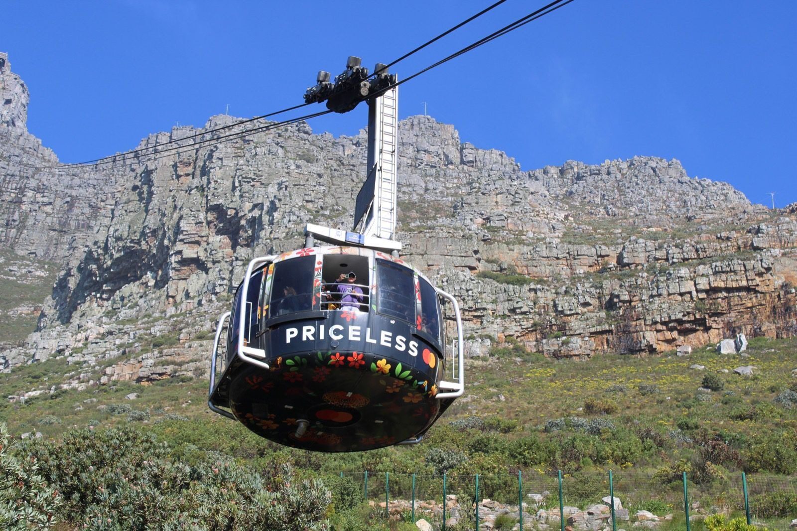 A cable car is going up the mountain side.