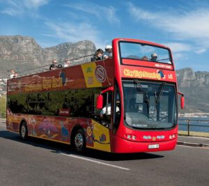 A double decker bus driving down the street.