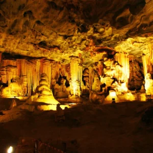 A cave with many statues in it